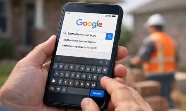 Person searching a local business name on a smartphone in a residential neighborhood